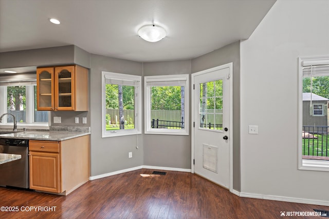 3561 Eastwind Dr, Anchorage, AK 99516 - kitchen featuring dishwasher, light stone counters, dark wood-type flooring, glass insert cabinets, and brown cabinets