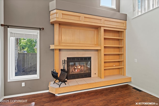 3561 Eastwind Dr, Anchorage, AK 99516 - detailed view of a tile fireplace and wood finished floors