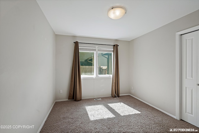 3561 Eastwind Dr, Anchorage, AK 99516 - carpeted spare room featuring baseboards