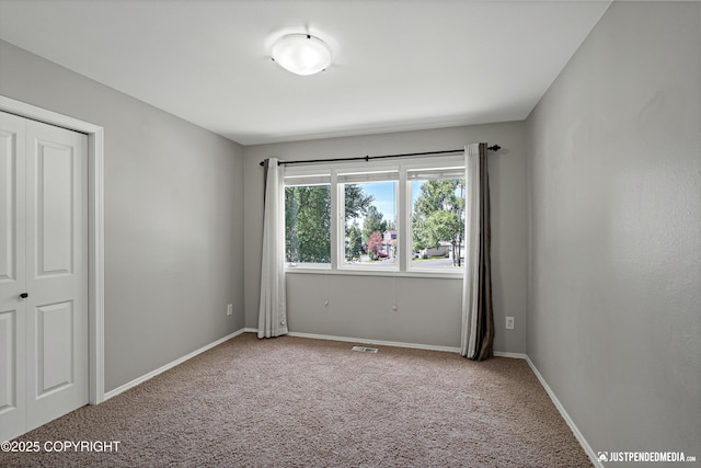 3561 Eastwind Dr, Anchorage, AK 99516 - carpeted empty room with baseboards