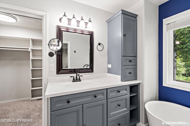 3561 Eastwind Dr, Anchorage, AK 99516 - bathroom featuring a soaking tub, vanity, and a spacious closet