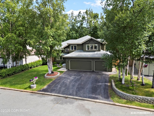 3561 Eastwind Dr, Anchorage, AK 99516 - view of front facade featuring an attached garage, asphalt driveway, and a front lawn