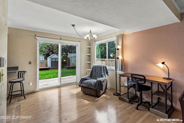 8051 Evans Cir, Anchorage, AK 99507 - office area with a textured wall, wood finished floors, a textured ceiling, healthy amount of natural light, and a chandelier