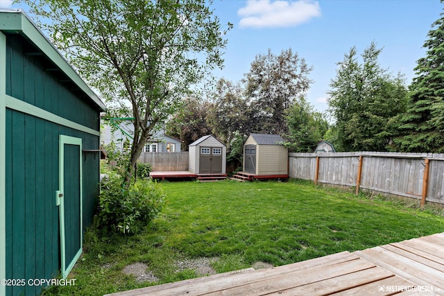 8051 Evans Cir, Anchorage, AK 99507 - fenced backyard with a shed and a deck