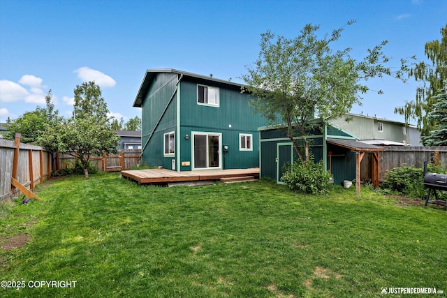8051 Evans Cir, Anchorage, AK 99507 - back of property with a fenced backyard and a wooden deck