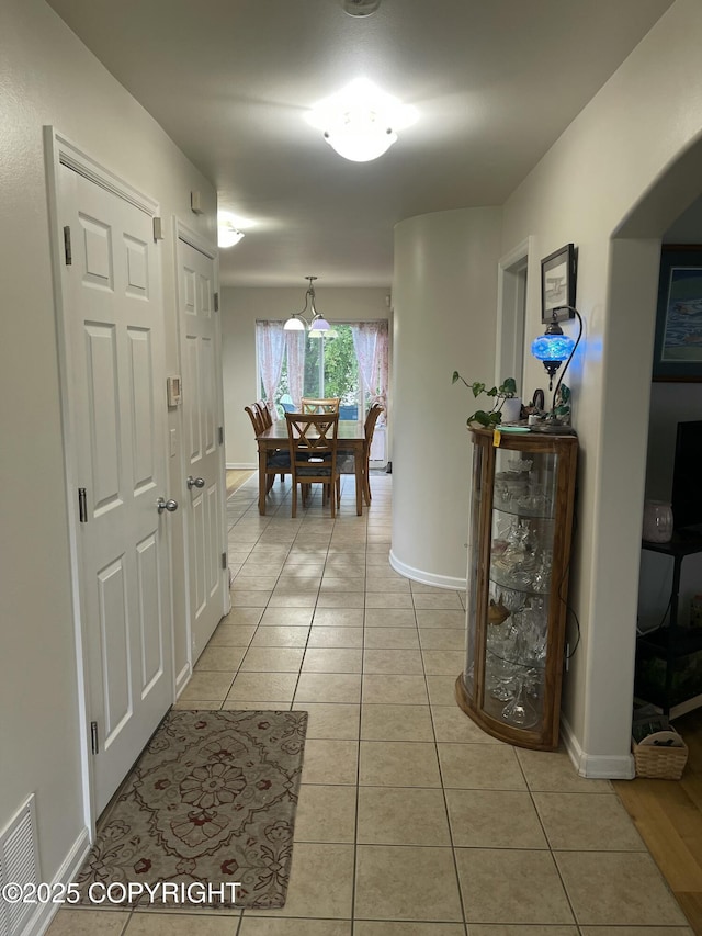 5693 Yukon Charlie Loop, Anchorage, AK 99502 - corridor with light tile patterned floors and baseboards