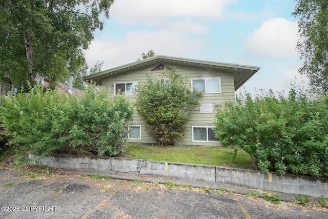 4111 Grape Pl, Anchorage, AK 99508 - view of side of home with uncovered parking