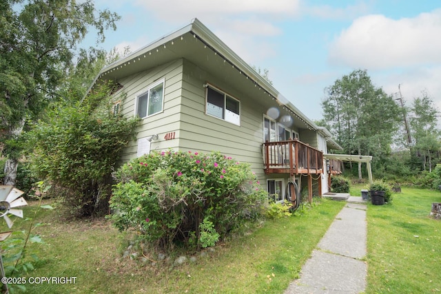 4111 Grape Pl, Anchorage, AK 99508 - view of side of home with a lawn and a deck