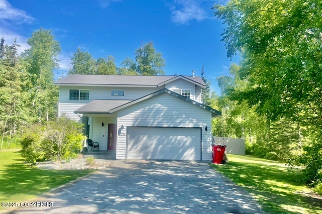 2711 N Woodfield Dr, Wasilla, AK 99654 - traditional-style home featuring driveway, a front lawn, and an attached garage