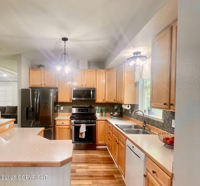 2711 N Woodfield Dr, Wasilla, AK 99654 - kitchen featuring stainless steel appliances, light brown cabinets, and tasteful backsplash