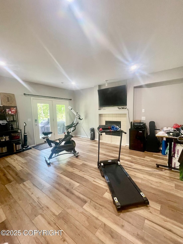 2711 N Woodfield Dr, Wasilla, AK 99654 - exercise room with wood finished floors and french doors