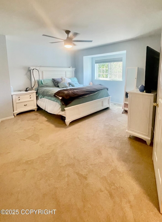 2711 N Woodfield Dr, Wasilla, AK 99654 - bedroom with light colored carpet and a ceiling fan