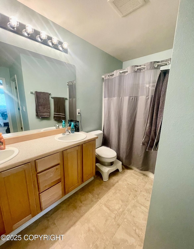 2711 N Woodfield Dr, Wasilla, AK 99654 - full bath featuring double vanity and curtained shower