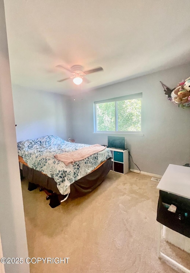 2711 N Woodfield Dr, Wasilla, AK 99654 - carpeted bedroom with a ceiling fan