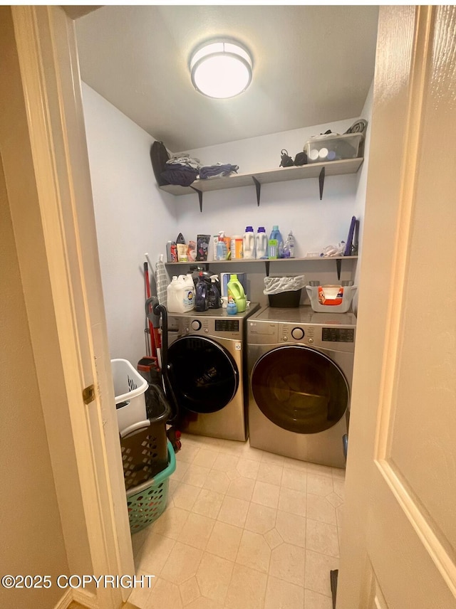 2711 N Woodfield Dr, Wasilla, AK 99654 - laundry area with washing machine and clothes dryer and tile patterned floors