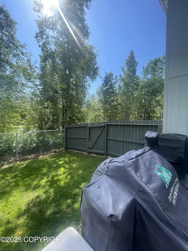 2711 N Woodfield Dr, Wasilla, AK 99654 - fenced backyard featuring a gate