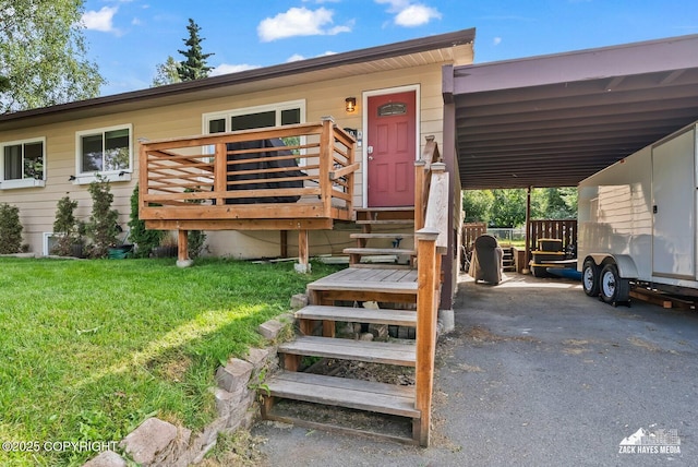 7200 Kiska Cir, Anchorage, AK 99504 - view of front of property with an attached carport, a front yard, a deck, and asphalt driveway