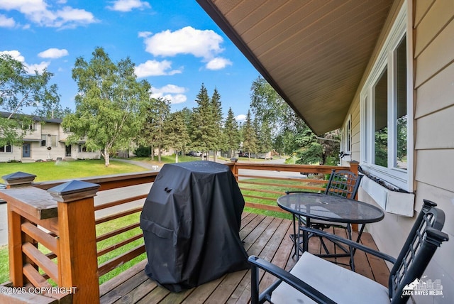 7200 Kiska Cir, Anchorage, AK 99504 - wooden deck with area for grilling and a yard
