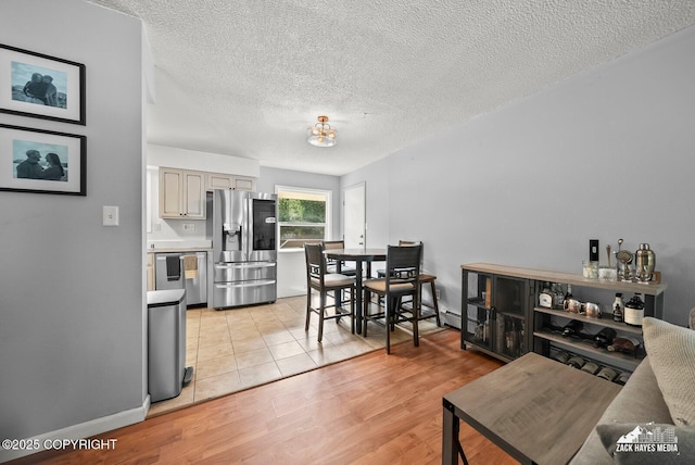 7200 Kiska Cir, Anchorage, AK 99504 - living area with a textured ceiling and light wood-style floors