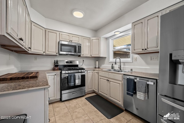 7200 Kiska Cir, Anchorage, AK 99504 - kitchen featuring appliances with stainless steel finishes, light tile patterned floors, and dark countertops
