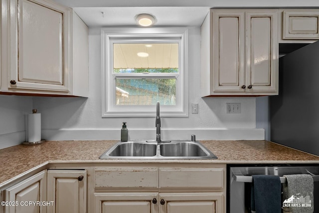 7200 Kiska Cir, Anchorage, AK 99504 - kitchen with dishwasher, cream cabinetry, and light countertops