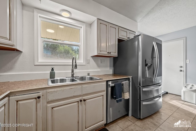 7200 Kiska Cir, Anchorage, AK 99504 - kitchen with stainless steel appliances, light tile patterned floors, light countertops, and a textured ceiling