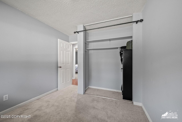 7200 Kiska Cir, Anchorage, AK 99504 - unfurnished bedroom with a closet, carpet flooring, and a textured ceiling