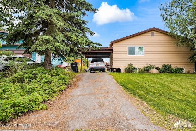 7200 Kiska Cir, Anchorage, AK 99504 - view of side of property with an attached carport, driveway, and a lawn