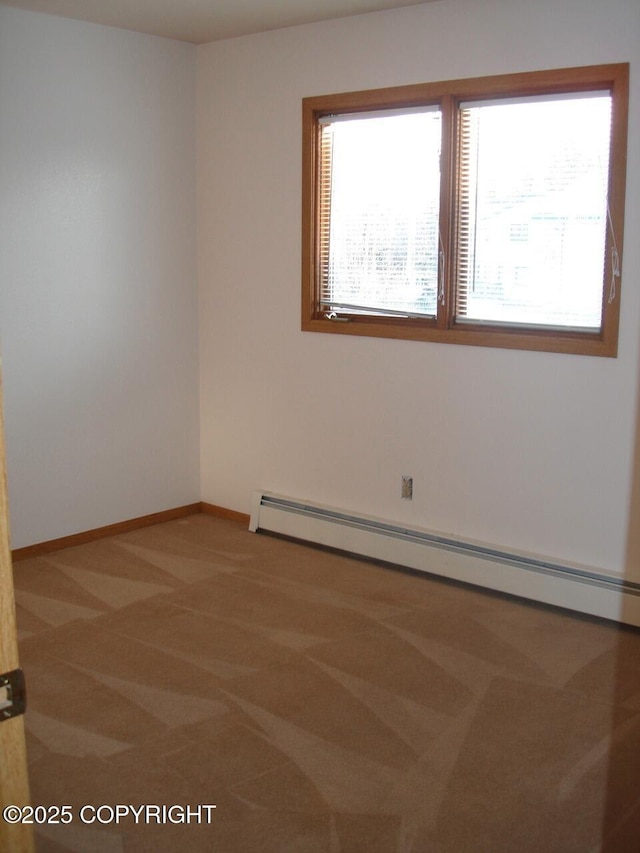 1911 Marthas Vineyard Cir, Anchorage, AK 99507 - carpeted empty room featuring a baseboard heating unit and baseboards