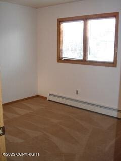 1911 Marthas Vineyard Cir, Anchorage, AK 99507 - empty room featuring a baseboard heating unit and baseboards