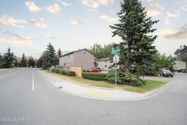 1911 Marthas Vineyard Cir, Anchorage, AK 99507 - view of asphalt road with sidewalks, curbs, and traffic signs