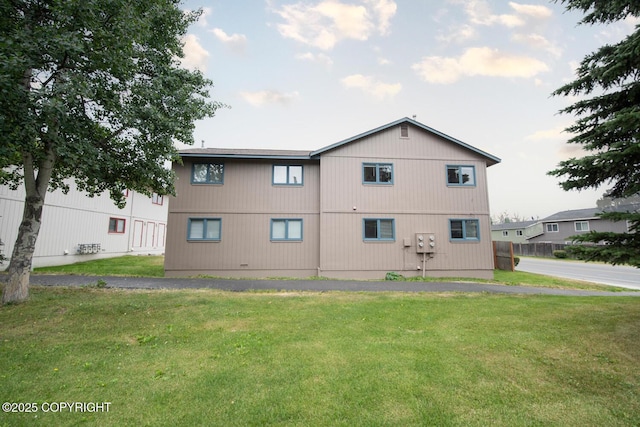 1911 Marthas Vineyard Cir, Anchorage, AK 99507 - back of property featuring a lawn