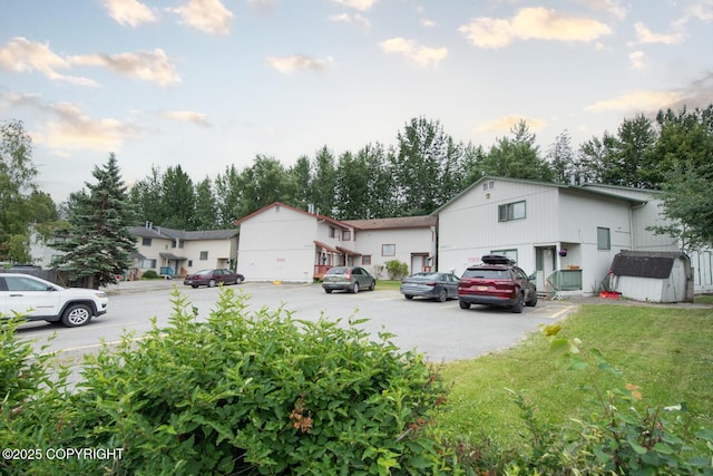 1911 Marthas Vineyard Cir, Anchorage, AK 99507 - view of front of property with a storage unit, uncovered parking, and a front lawn