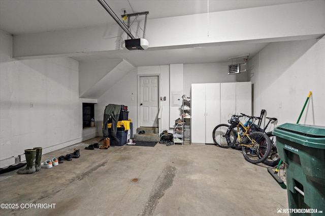 1544 State St, Anchorage, AK 99504 - garage featuring a heating unit and a garage door opener