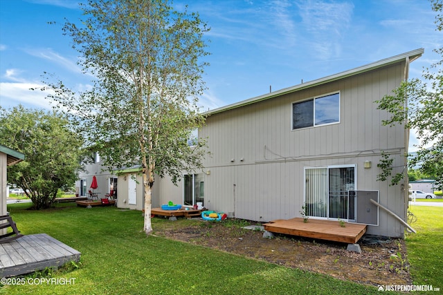1544 State St, Anchorage, AK 99504 - back of property with a wooden deck and a lawn