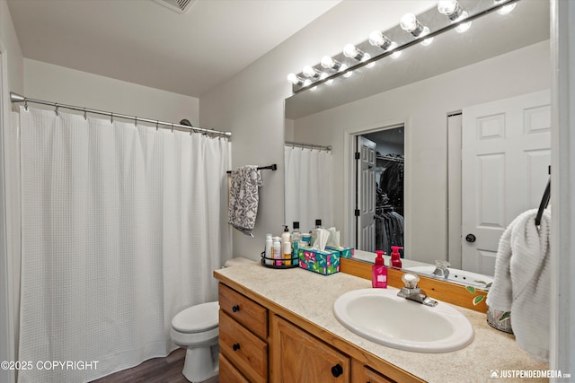 1544 State St, Anchorage, AK 99504 - full bath with vanity, wood finished floors, curtained shower, and a spacious closet