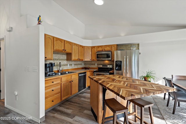 1544 State St, Anchorage, AK 99504 - kitchen featuring decorative backsplash, stainless steel appliances, dark wood-type flooring, lofted ceiling, and light countertops