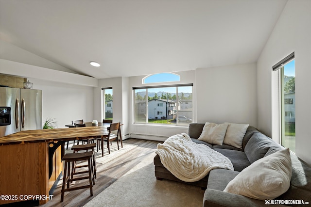 1544 State St, Anchorage, AK 99504 - living area with lofted ceiling, plenty of natural light, and wood finished floors