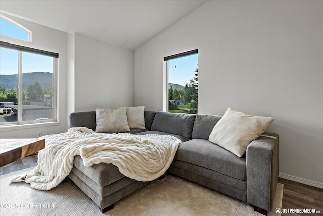 1544 State St, Anchorage, AK 99504 - living room with a mountain view, vaulted ceiling, and wood finished floors