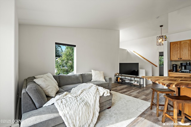 1544 State St, Anchorage, AK 99504 - living area featuring wood finished floors and a chandelier