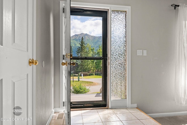 9645 Nulato Cir, Eagle River, AK 99577 - doorway with a mountain view and light tile patterned floors