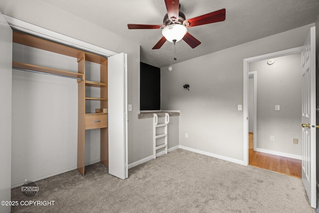 9645 Nulato Cir, Eagle River, AK 99577 - unfurnished bedroom featuring carpet floors, a ceiling fan, and a closet