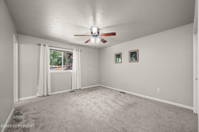 9645 Nulato Cir, Eagle River, AK 99577 - carpeted spare room with ceiling fan and a textured ceiling