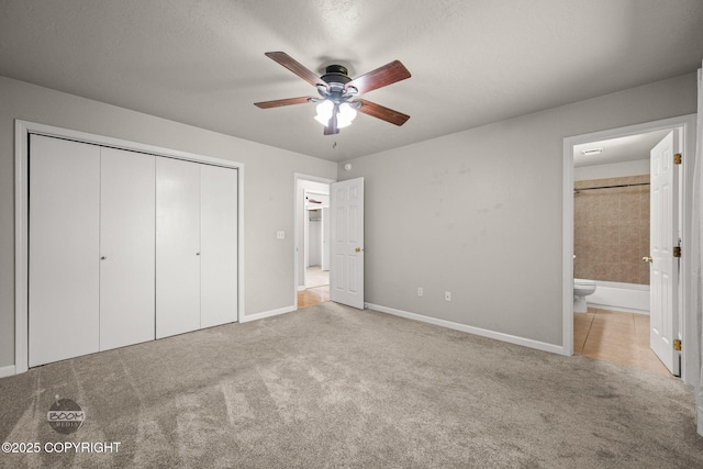 9645 Nulato Cir, Eagle River, AK 99577 - unfurnished bedroom with a closet, carpet flooring, connected bathroom, and ceiling fan