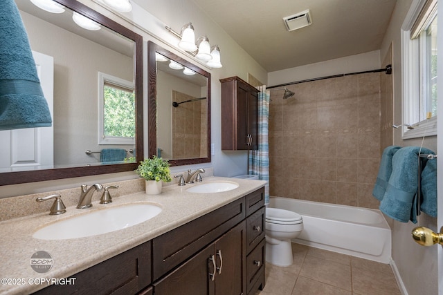 9645 Nulato Cir, Eagle River, AK 99577 - bathroom featuring tile patterned floors, double vanity, and tub / shower combination