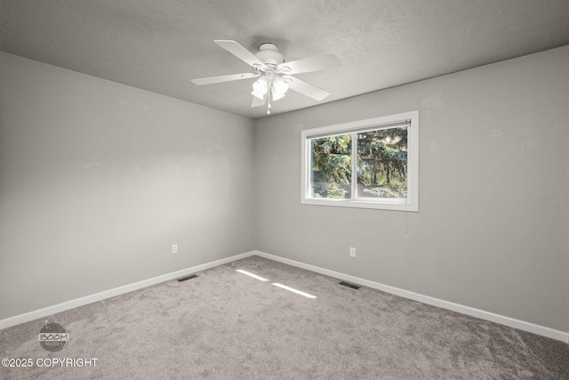 9645 Nulato Cir, Eagle River, AK 99577 - unfurnished room with carpet floors, a ceiling fan, and a textured ceiling