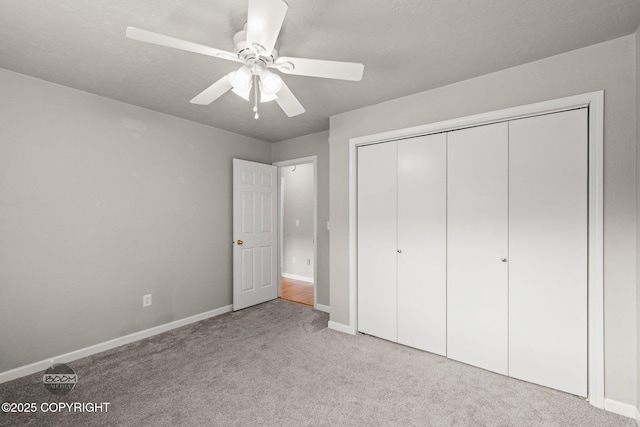 9645 Nulato Cir, Eagle River, AK 99577 - unfurnished bedroom featuring carpet flooring, a closet, and a ceiling fan