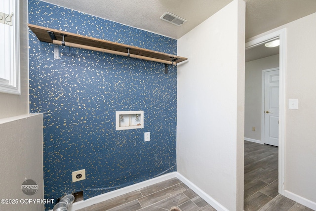 9645 Nulato Cir, Eagle River, AK 99577 - washroom with wood finish floors, hookup for a washing machine, hookup for an electric dryer, and wallpapered walls