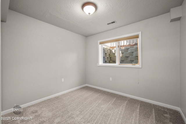 9645 Nulato Cir, Eagle River, AK 99577 - unfurnished room featuring carpet flooring and a textured ceiling
