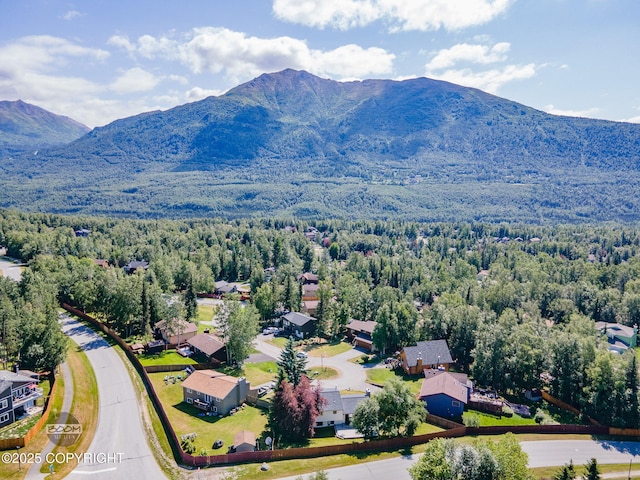 9645 Nulato Cir, Eagle River, AK 99577 - aerial perspective of suburban area with a heavily wooded area and mountains